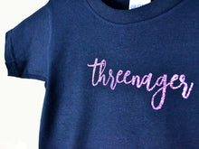 Load image into Gallery viewer, Close up detail of the glitter text threenager on a t-shirt