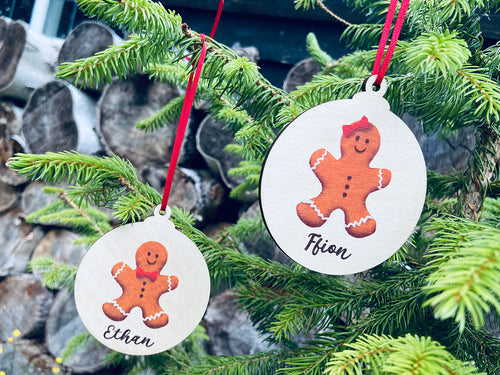 Gorgeous hand pressed personalised wooden bauble with gingerbread men design for both boys and girls