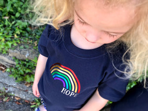 Looking down on her Rainbow of hope t-shirt