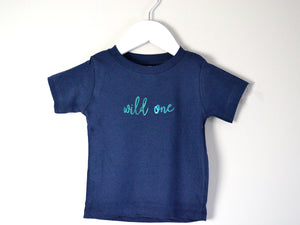 Navy Wild One T-shirt on a hanger, perfect for 1st birthday baby boy