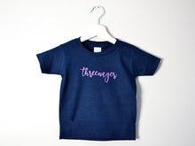 Load image into Gallery viewer, Threenager t-shirt hanging up against a wall