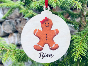 Personalised gingerbread girl on a wooden Christmas bauble