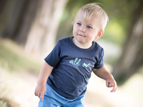 Navy Wild One T-shirt by Little Foxglove, modelled on a one year old boy